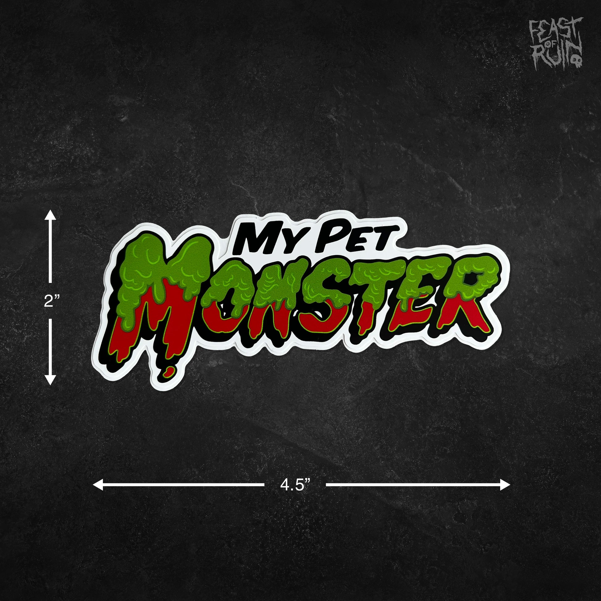 A die-cut vinyl sticker with the text 'My Pet Monster' in a green-and-red dripping monster font with a white outline, shown on a dark textured background with dimension arrows indicating 2 inches tall by 4.5 inches wide.